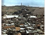 Temple area with flat roofed houses in foreground